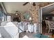 Sunroom featuring a brick wall, a ceiling fan, and a comfortable seating area at 944 Clear Creek Cir, Lincolnton, NC 28092