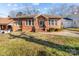 Charming brick home with well-maintained lawn and inviting entrance at 1029 E Main St, Albemarle, NC 28001