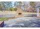 Spacious backyard with brick fireplace and concrete area for relaxing and entertaining at 105 Partridge Bluff Ne Dr, Concord, NC 28025