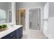 Bright bathroom with a walk-in shower, vanity, and a separate toilet area, maximizing functionality and space at 105 Partridge Bluff Ne Dr, Concord, NC 28025
