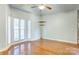 Bright bedroom with wood floors, corner windows, and neutral walls at 105 Partridge Bluff Ne Dr, Concord, NC 28025