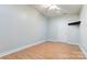 A bright bedroom with hard wood floors, ample space, and plenty of natural light at 105 Partridge Bluff Ne Dr, Concord, NC 28025