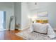 Spacious bedroom with hardwood floors, a decorative rug, and calming paint, creating a serene atmosphere at 105 Partridge Bluff Ne Dr, Concord, NC 28025