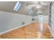 Spacious bonus room with skylights, built-in shelving and wood flooring at 105 Partridge Bluff Ne Dr, Concord, NC 28025