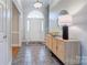 Bright entryway with a beautiful arched window above the front door and a stylish cabinet with decor at 105 Partridge Bluff Ne Dr, Concord, NC 28025