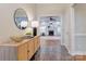 Foyer with dark tile, light walls, wooden table, mirror, and open access to the living room at 105 Partridge Bluff Ne Dr, Concord, NC 28025