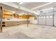Spacious garage with an abundance of shelving, perfect for storage and organization at 105 Partridge Bluff Ne Dr, Concord, NC 28025