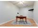 Functional home office with natural light, a desk, and hardwood floors, perfect for remote work or study at 105 Partridge Bluff Ne Dr, Concord, NC 28025
