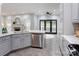 Bright kitchen with stainless steel dishwasher and view to open-concept living room at 105 Partridge Bluff Ne Dr, Concord, NC 28025