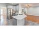 Modern kitchen features stainless steel appliances, light countertops, and classic gray cabinetry at 105 Partridge Bluff Ne Dr, Concord, NC 28025