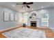 Inviting living room with a fireplace, hardwood floors, and neutral decor at 105 Partridge Bluff Ne Dr, Concord, NC 28025