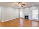 Bright living room features hardwood floors, a cozy fireplace, and plenty of natural light at 105 Partridge Bluff Ne Dr, Concord, NC 28025