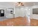 Spacious living room with hardwood floors opens to the kitchen and foyer, perfect for entertaining at 105 Partridge Bluff Ne Dr, Concord, NC 28025