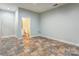 Neutral room with tile flooring and bright light from open doorway at 105 Partridge Bluff Ne Dr, Concord, NC 28025