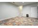 A light, bright room with durable tile flooring leads to stairwell at 105 Partridge Bluff Ne Dr, Concord, NC 28025