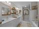 Bathroom featuring double sinks, decorative mirrors, and separate shower/tub at 121 Yorkshire Dr, Salisbury, NC 28144