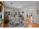 Dining room with hardwood floors, a modern mirror, and a table set for four at 121 Yorkshire Dr, Salisbury, NC 28144