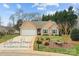 Charming single-Gathering home with a well-manicured lawn, a two-car garage, and a welcoming front entrance at 121 Yorkshire Dr, Salisbury, NC 28144