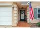 Inviting front entry with a decorative wreath, American flag, sconce lighting and neutral tones at 121 Yorkshire Dr, Salisbury, NC 28144