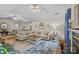 Open-concept living room with neutral walls, plush seating, fireplace, and hardwood floors at 121 Yorkshire Dr, Salisbury, NC 28144