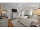 Bright bedroom with lots of natural light and view of a dresser, mounted TV, and other bedroom furniture at 121 Yorkshire Dr, Salisbury, NC 28144