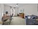 Well-lit office space featuring neutral carpet, ceiling fan and large window overlooking neighborhood at 121 Yorkshire Dr, Salisbury, NC 28144