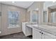 Bathroom featuring double sinks, vanity and a window allowing for natural light at 1317 Liberty Rd, Chester, SC 29706