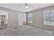 This bedroom offers natural light through a large window and includes a ceiling fan at 1317 Liberty Rd, Chester, SC 29706