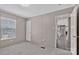 Cozy bedroom with a window, neutral walls, and an open doorway leading to other areas of the house at 1317 Liberty Rd, Chester, SC 29706