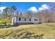 Single-story home with attractive siding, a welcoming front porch, and a well-kept lawn at 1317 Liberty Rd, Chester, SC 29706