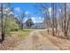 Charming single-story home with gray siding, inviting front porch, and a long driveway at 1317 Liberty Rd, Chester, SC 29706
