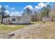 Exterior view showing the house, a shed, and a gravel driveway at 1317 Liberty Rd, Chester, SC 29706
