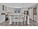 Stylish kitchen island with white cabinetry, wood countertop, and modern appliances at 1317 Liberty Rd, Chester, SC 29706