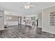 Open-concept living room featuring gray flooring, white walls and ceiling fan at 1317 Liberty Rd, Chester, SC 29706