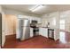 Modern kitchen featuring stainless steel appliances, ample cabinet space, and a view to the living room at 134 Chere Helen Dr, Mooresville, NC 28115