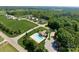 Aerial view featuring the community pool with nearby residential homes and lush greenery at 145 High Rock Ct # 03, Statesville, NC 28677