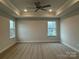 Spacious bedroom featuring a ceiling fan, recessed lighting, and two large windows at 145 High Rock Ct # 03, Statesville, NC 28677