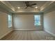 Spacious bedroom featuring a ceiling fan, recessed lighting, and two large windows at 145 High Rock Ct # 03, Statesville, NC 28677