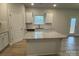Modern kitchen with granite countertops, stainless steel appliances, and a central island for culinary enthusiasts at 145 High Rock Ct # 03, Statesville, NC 28677