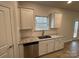 Bright kitchen showcasing white cabinets, stainless steel appliances, and granite countertops at 145 High Rock Ct # 03, Statesville, NC 28677