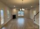 Spacious living room with a fireplace, ample natural light, and an open floor plan for seamless entertaining at 145 High Rock Ct # 03, Statesville, NC 28677