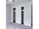 Bedroom with sliding closet doors and view to hall at 1606 Mt Gallant Rd, Rock Hill, SC 29732