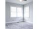 This bedroom has two windows and neutral walls and carpeting at 1606 Mt Gallant Rd, Rock Hill, SC 29732