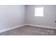 This is a bedroom with gray walls, carpet, white trim, and a window at 1606 Mt Gallant Rd, Rock Hill, SC 29732