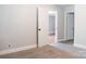 This bedroom is carpeted and features a open white door at 1606 Mt Gallant Rd, Rock Hill, SC 29732