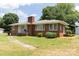 Quaint brick house with a manicured lawn and walkway leading to the front entrance at 1606 Mt Gallant Rd, Rock Hill, SC 29732
