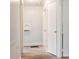 Hallway with wood-look flooring and white walls and doors at 1606 Mt Gallant Rd, Rock Hill, SC 29732