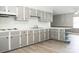 Kitchen featuring gray cabinets and wood-look flooring at 1606 Mt Gallant Rd, Rock Hill, SC 29732