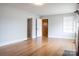 Spacious living room with hardwood floors, neutral walls, and a view to connected rooms at 1606 Mt Gallant Rd, Rock Hill, SC 29732