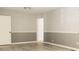 Bright living room with light gray lower walls, white upper walls, and wood-look flooring at 1606 Mt Gallant Rd, Rock Hill, SC 29732